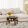 Rustic brown round coffee table featuring a wide tabletop and decorative side shelves, ideal for stylish small space.