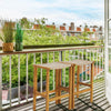 Set of 2 acacia wood bar stools with PE rattan seats, perfect for balcony relaxation and outdoor gatherings.