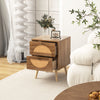 Rattan nightstand with two drawers and solid wood legs, featuring a charming bohemian style for bedroom or living room.