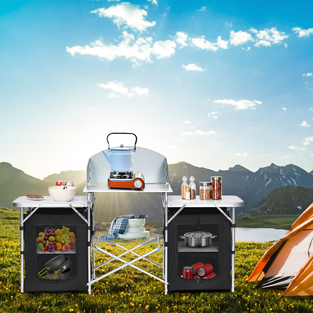 Folding camping table with storage organizer, featuring a large countertop and side tables, ideal for outdoor cooking.