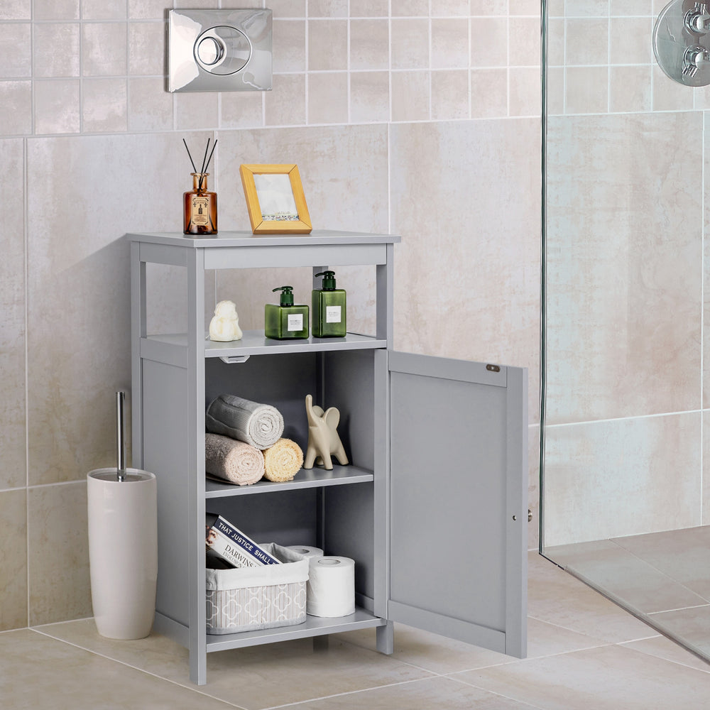 Gray bathroom wooden floor cabinet showcasing spacious interior with decorative items and towels for organized storage.