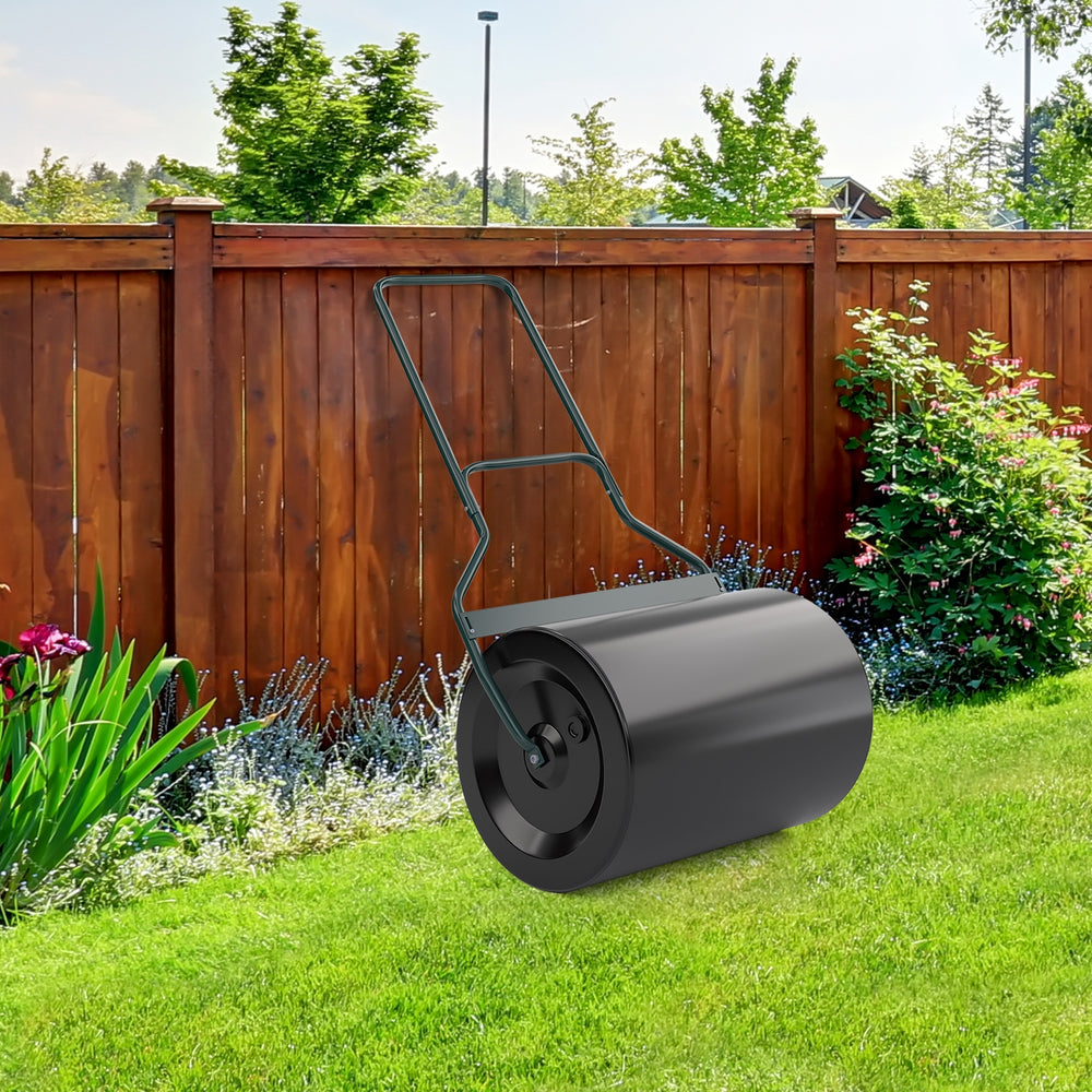 Lawn roller with U-shaped handle, green finish, 16-gallon capacity, ideal for flattening uneven ground in gardens.