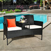 Wicker patio conversation set with removable cushions, featuring a tempered glass table, ideal for poolside relaxation.