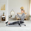 Adjustable double hydraulic resistance rowing machine with a user demonstrating a full-body workout in a modern home.