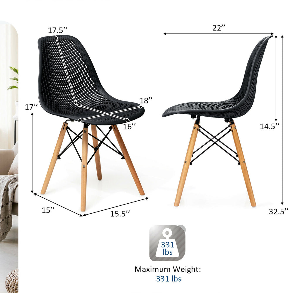Black modern plastic hollow chair with wood legs, ergonomic design, 331 lbs capacity, ideal for dining or office use.