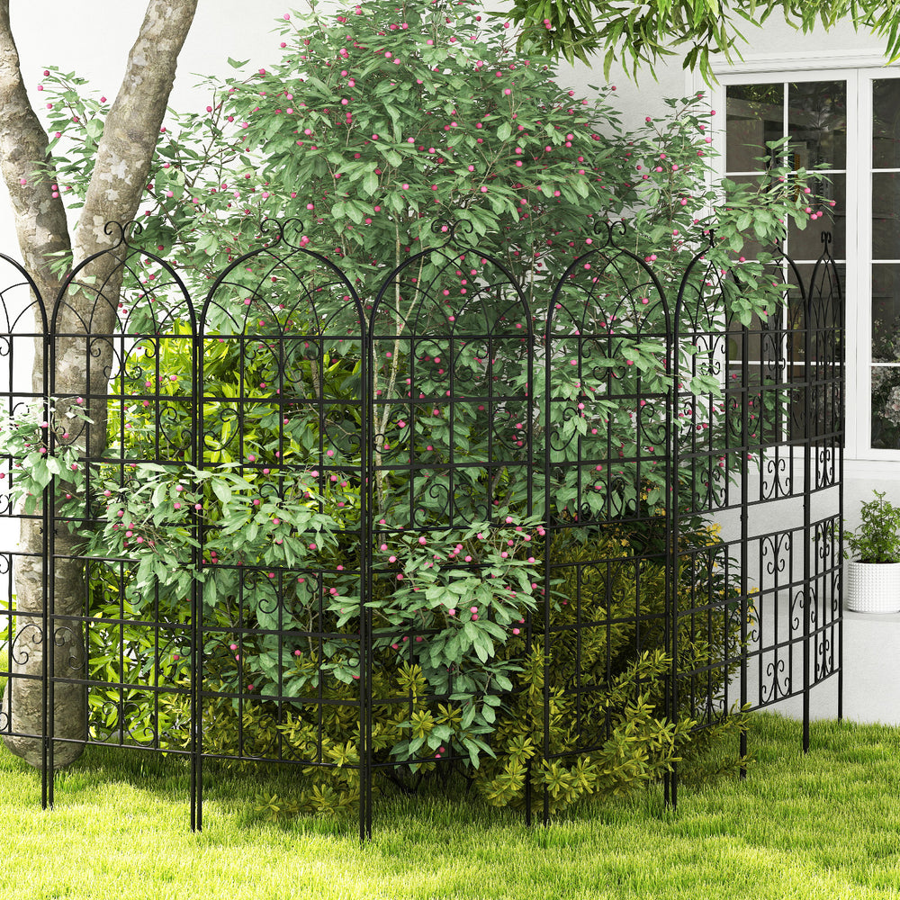 Metal garden trellis set with elegant arch top and butterfly pattern, providing support for climbing plants and vines.