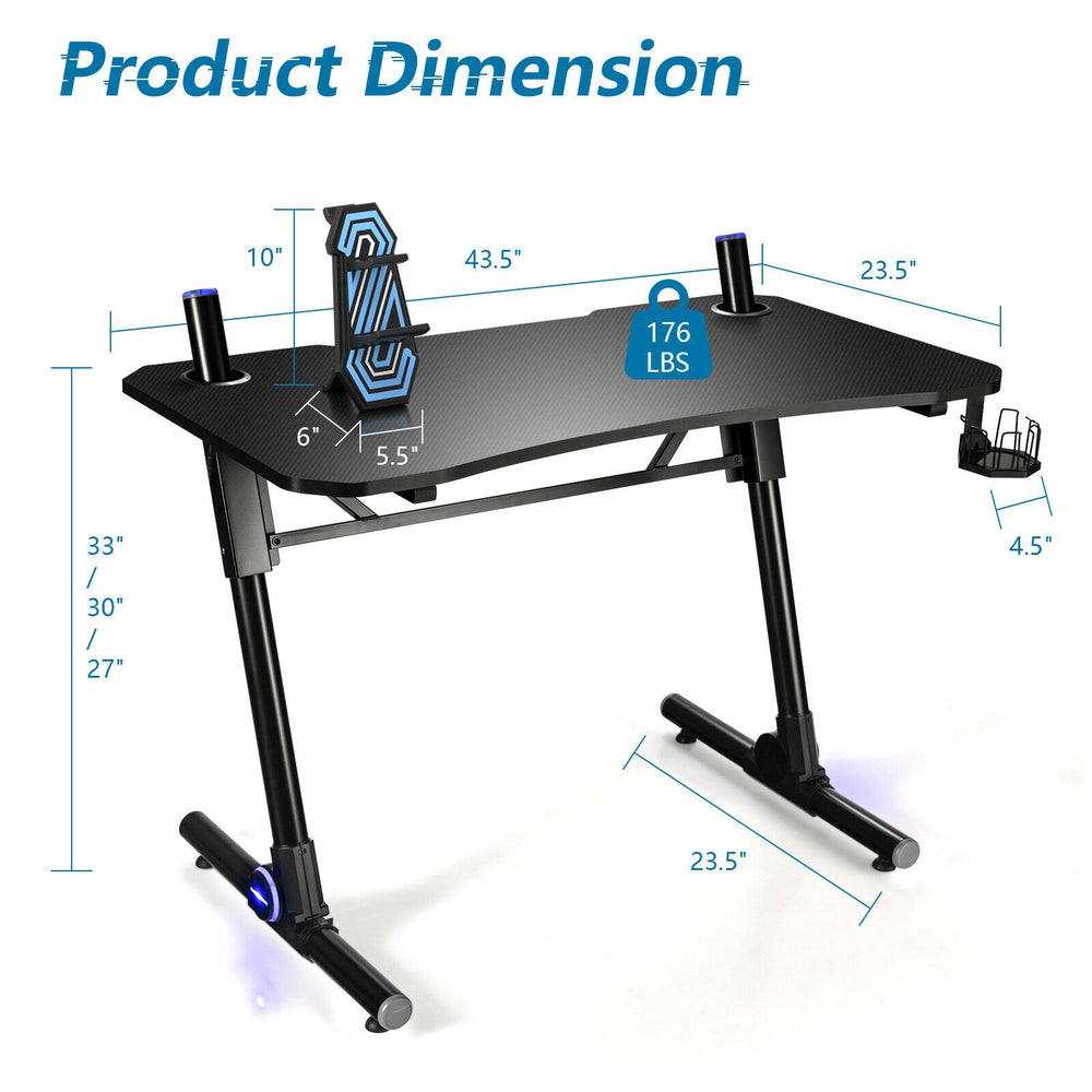 Height adjustable gaming desk with blue LED lights, carbon fiber surface, and Z-shaped legs for stability.