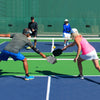 Portable 22-foot pickleball net set with a sturdy steel frame, ideal for indoor and outdoor games with easy assembly.