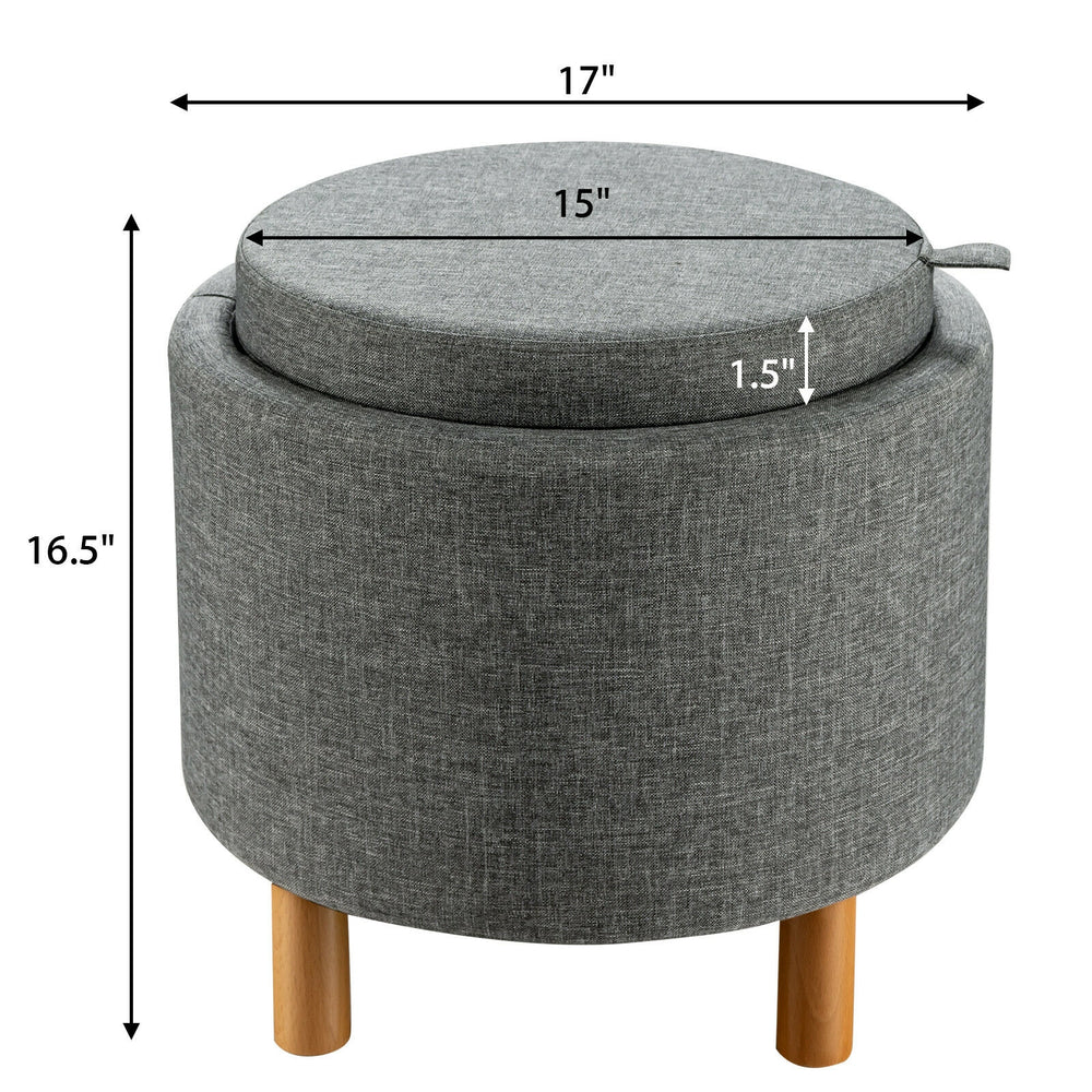 Round gray fabric storage ottoman with removable lid and wooden tray, featuring non-slip pads for stability and comfort.