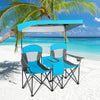 Portable folding camping canopy chairs in blue with cup holder and adjustable canopy, perfect for beach relaxation.