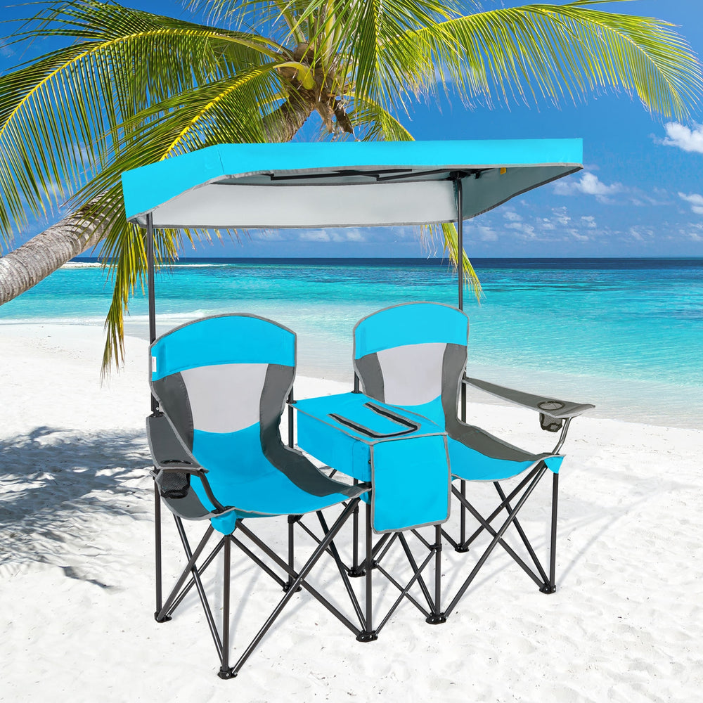 Portable folding camping canopy chairs in blue with cup holder and adjustable canopy, perfect for beach relaxation.