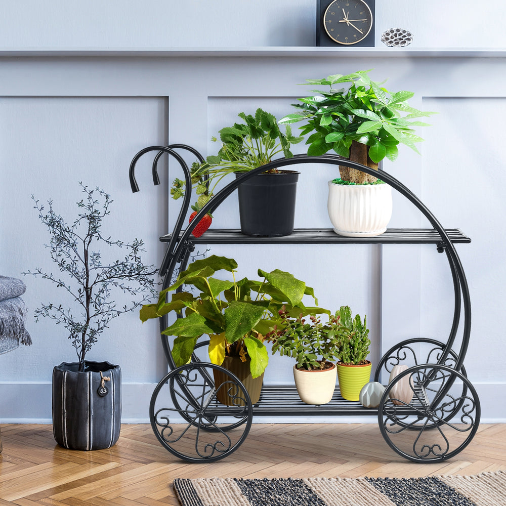 Two-tier heavy duty metal flower cart plant stand showcasing vibrant potted plants with a circular design and.