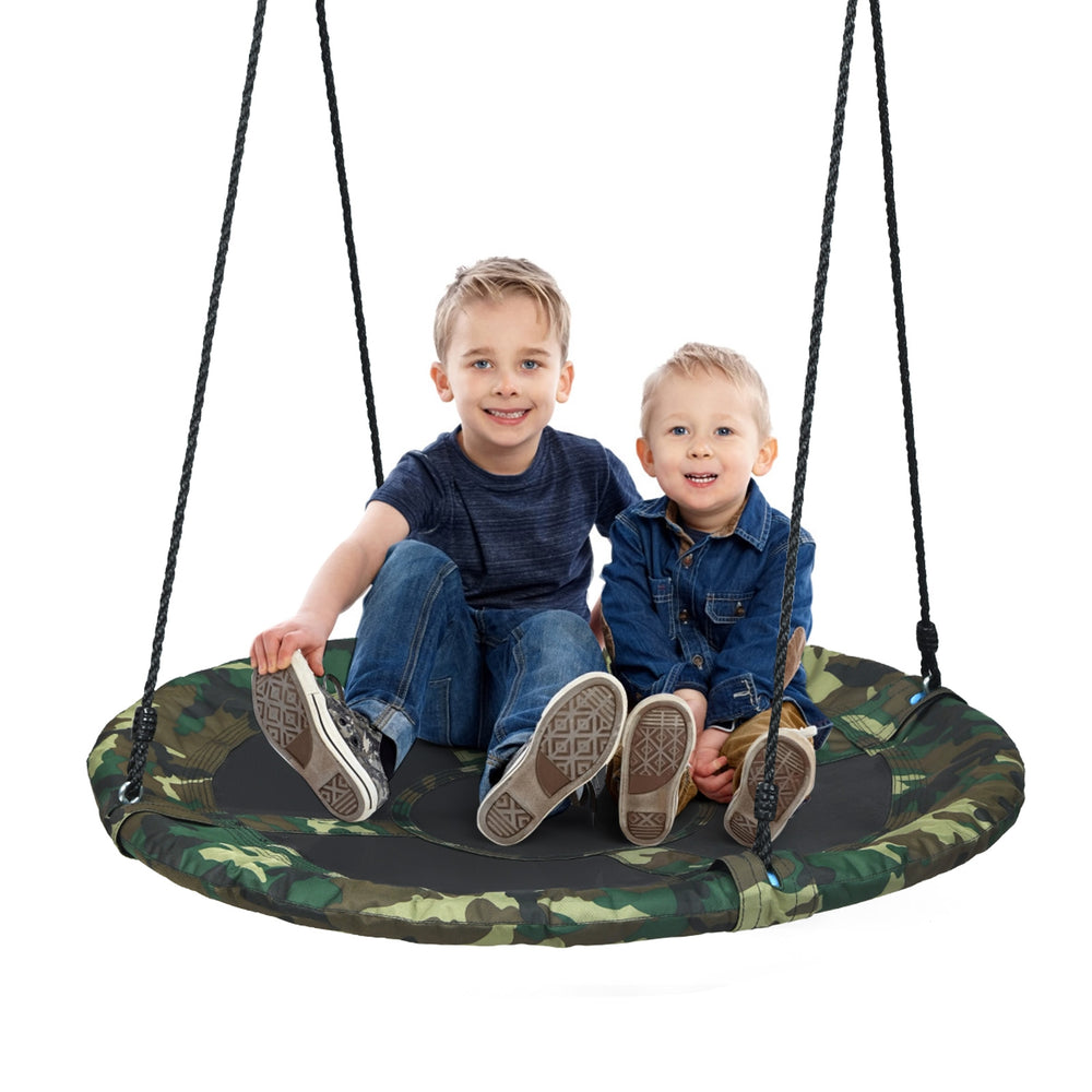Two children sitting on a 40-inch flying saucer tree swing made of weather-resistant fabric, perfect for outdoor play.