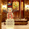 Pre-lit snowman decoration with 80 LED lights, showcasing a festive design with scarf and top hat for indoor/outdoor.