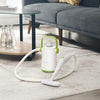 Portable 1000W hand-held steam cleaner in green with accessories, ideal for cleaning sofas and hard-to-reach areas.