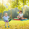 Two kids enjoying a colorful saucer tree swing and traditional swing set, perfect for outdoor fun and reducing screen.