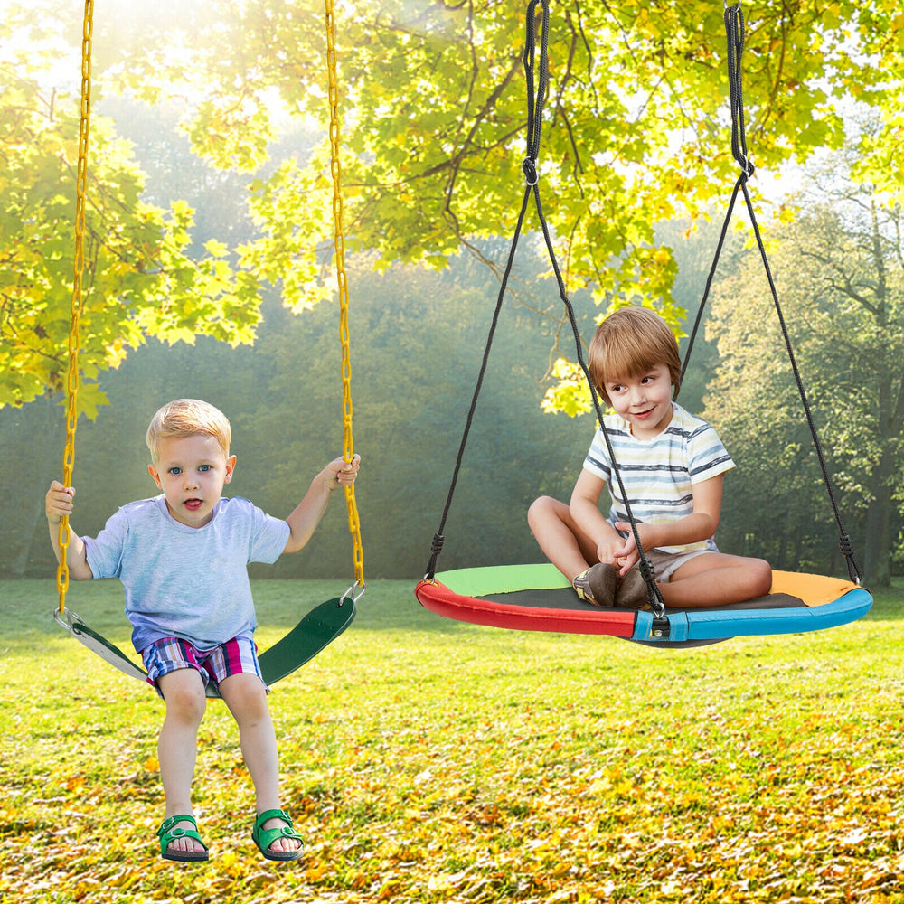 Two kids enjoying a colorful saucer tree swing and traditional swing set, perfect for outdoor fun and reducing screen.