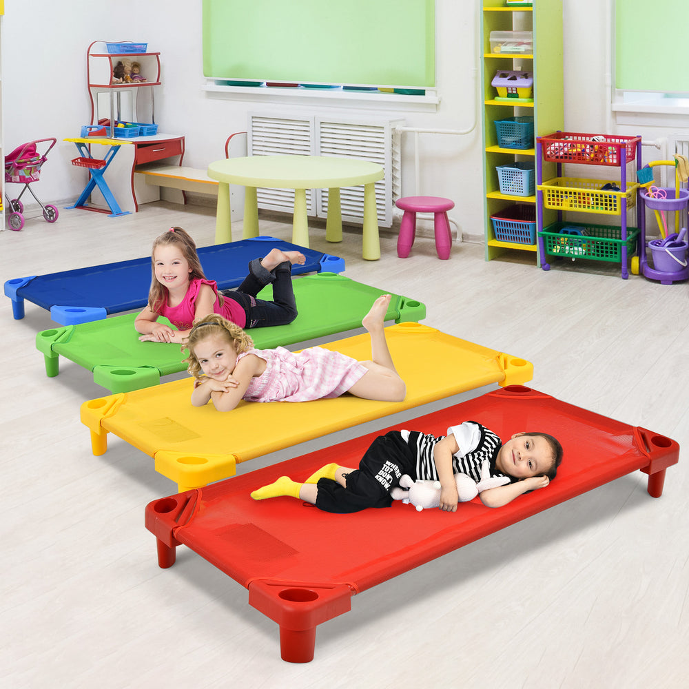 Colorful stackable naptime cots for kids in red, yellow, and blue, ideal for preschools and playrooms.