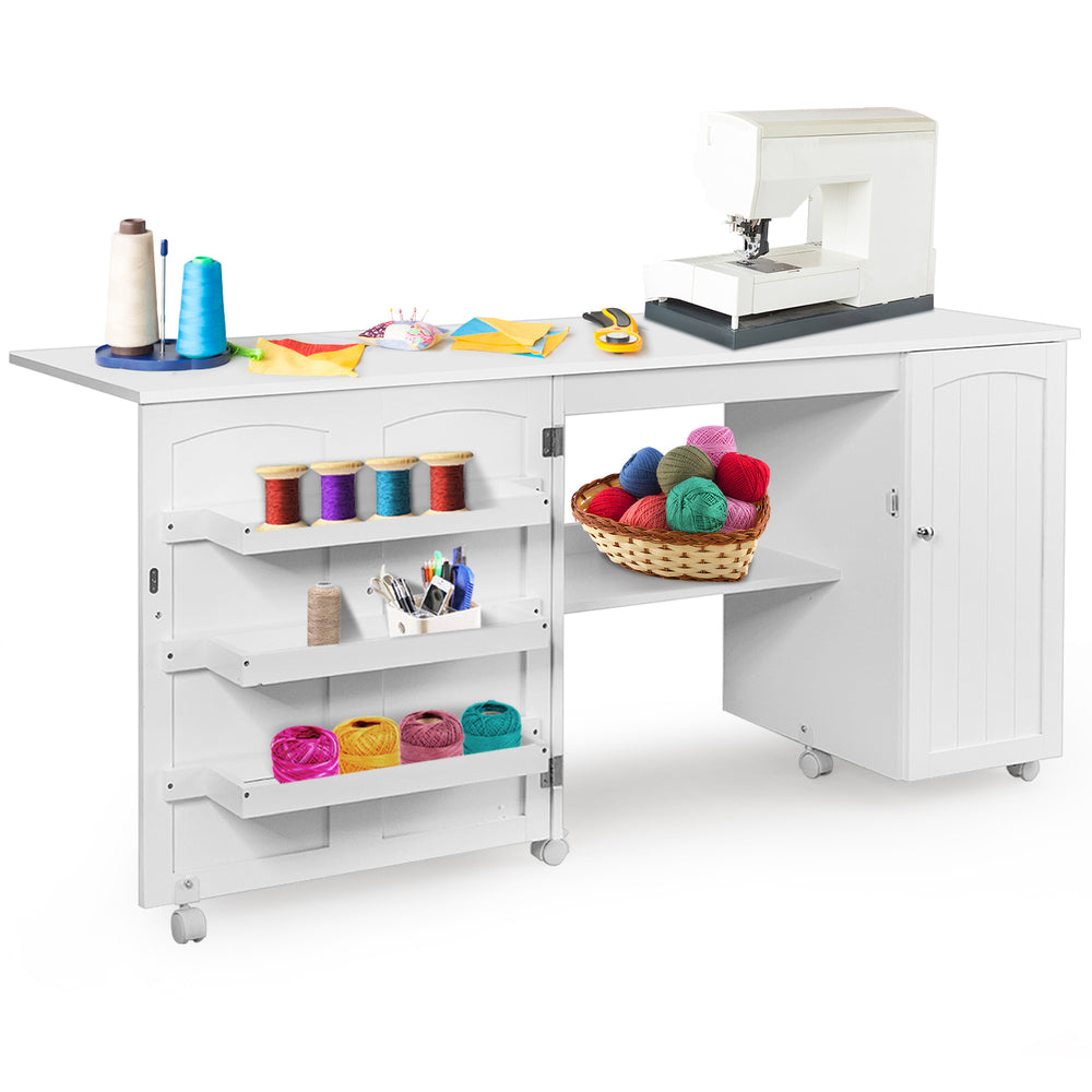 Folding sewing table in white with storage shelves, wheels, and a sewing machine, ideal for crafting and organization.