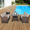 Three-piece hand-woven rattan outdoor sofa set with dining table, featuring soft cushions, ideal for poolside.