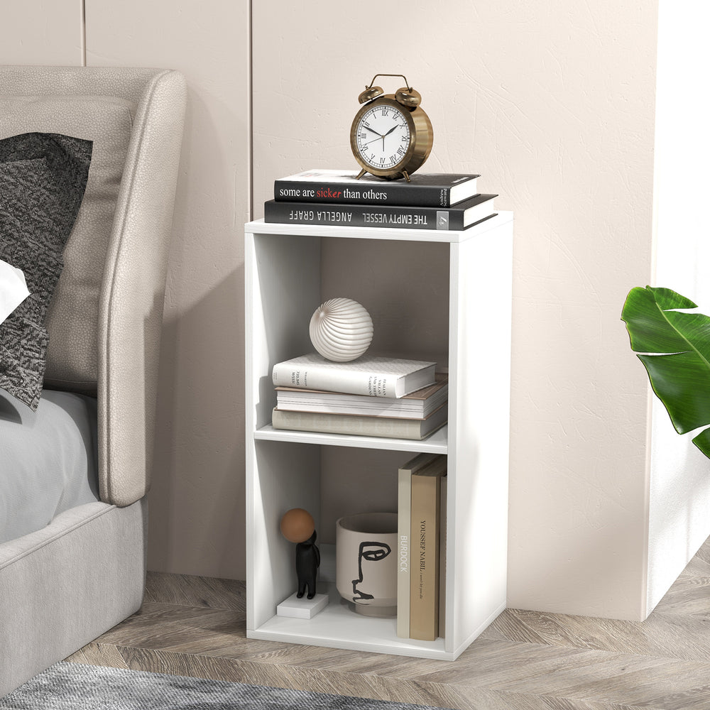 White 2-cube bookshelf with back guardrail, featuring ample storage for books and decorative items, ideal for bedroom.