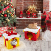 Two stacked gift box-shaped Christmas cat houses in red and yellow, featuring plush covering and festive decorations.