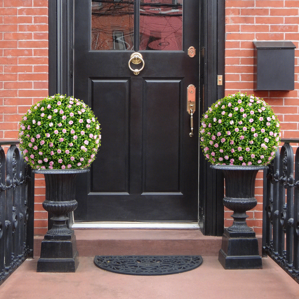 Two 17.5-inch artificial topiary balls with pink flowers in decorative planters, ideal for front porch or garden decor.