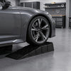 Low-profile car ramp set with a 2.5"/6.5 cm lift, designed for low-chassis vehicles, ideal for garage maintenance.
