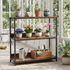 3-tier industrial bookshelf in rustic brown with potted plants and gardening tools, perfect for indoor decor.
