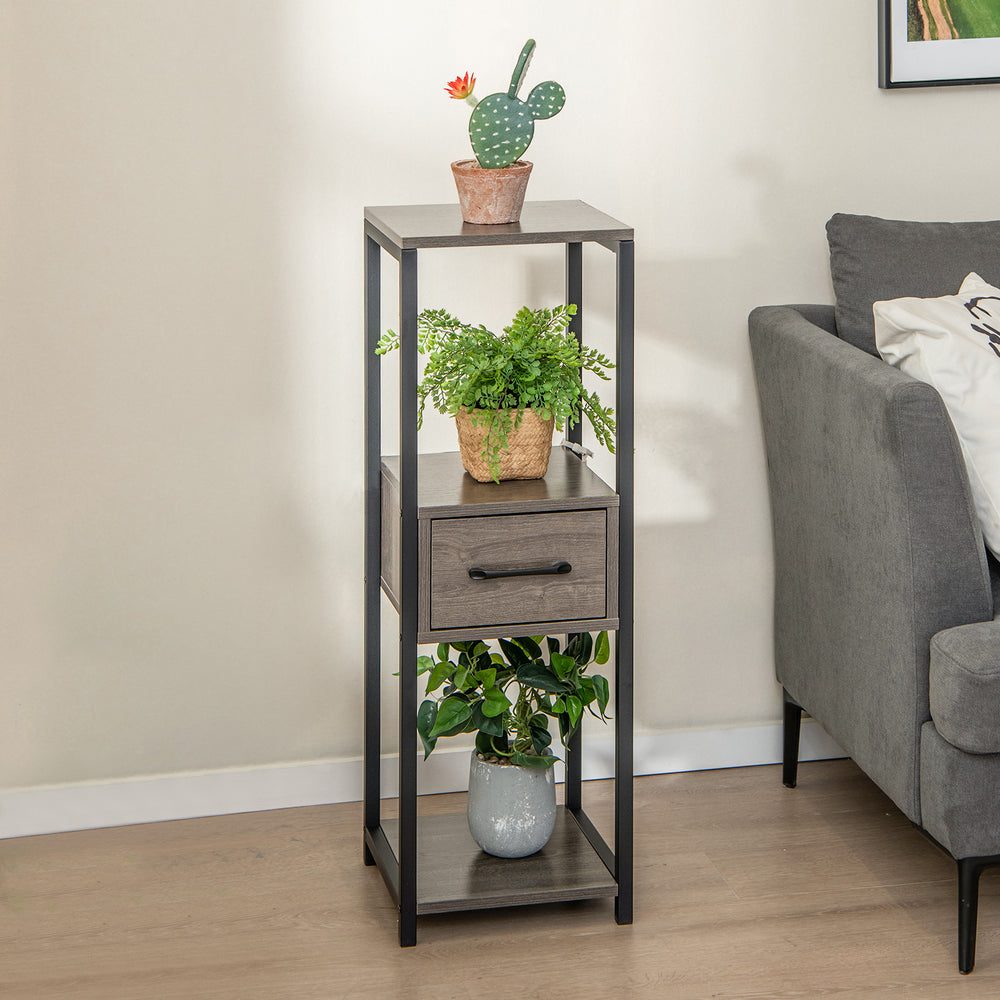 Three-tier gray metal plant stand with drawer, featuring a robust frame and faux wood grain, perfect for displaying.