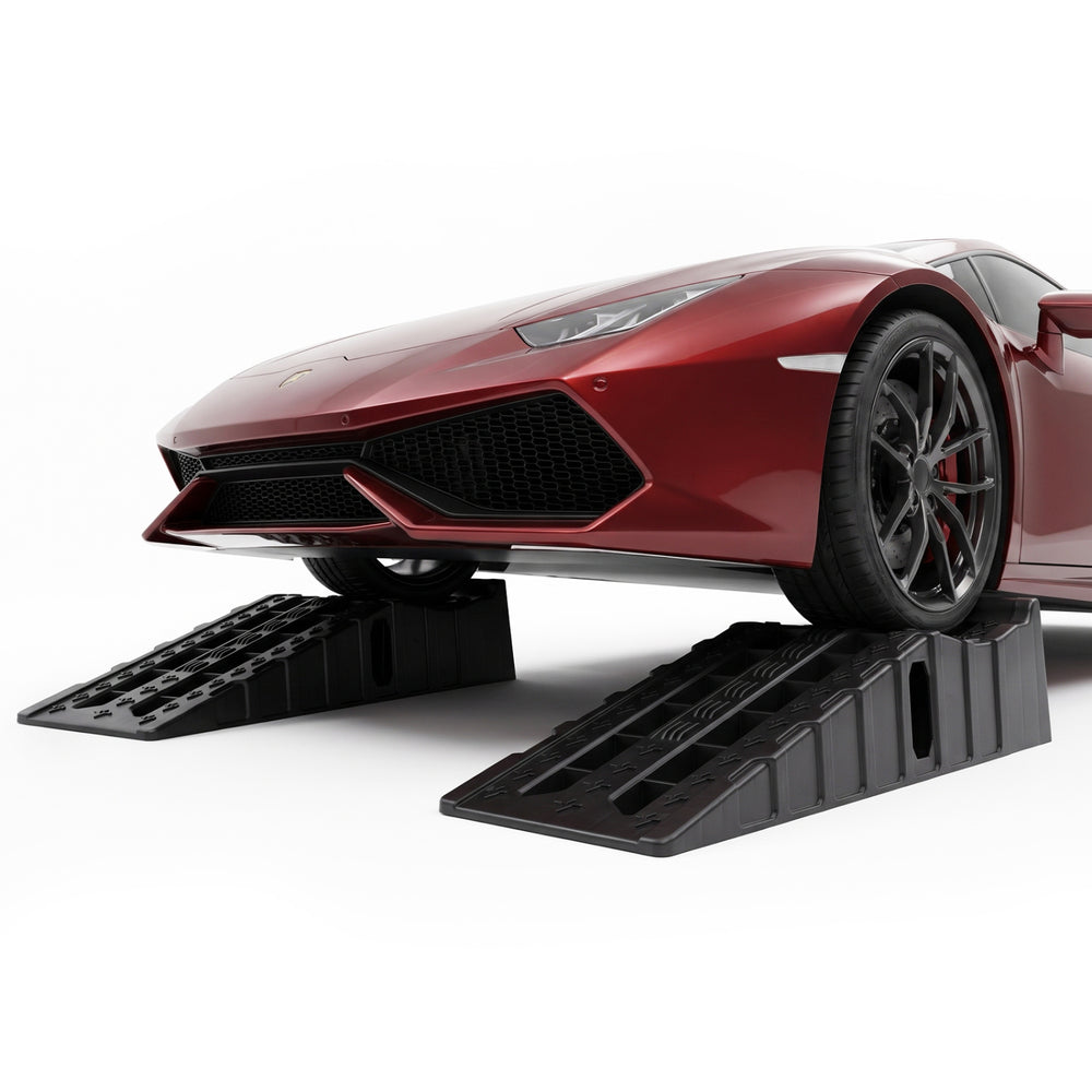 Car ramps with 6.4" lift height and 22,000 lbs capacity, ideal for vehicle maintenance and repairs on level surfaces.