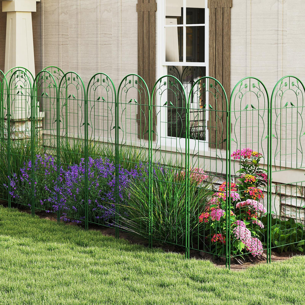 Green metal garden trellis set with flower patterns, providing sturdy support for climbing plants and vines outdoors.
