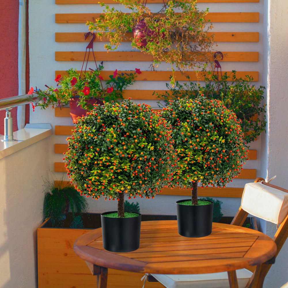 Two artificial boxwood topiary ball trees with orange fruit in black pots, perfect for home decoration and low.
