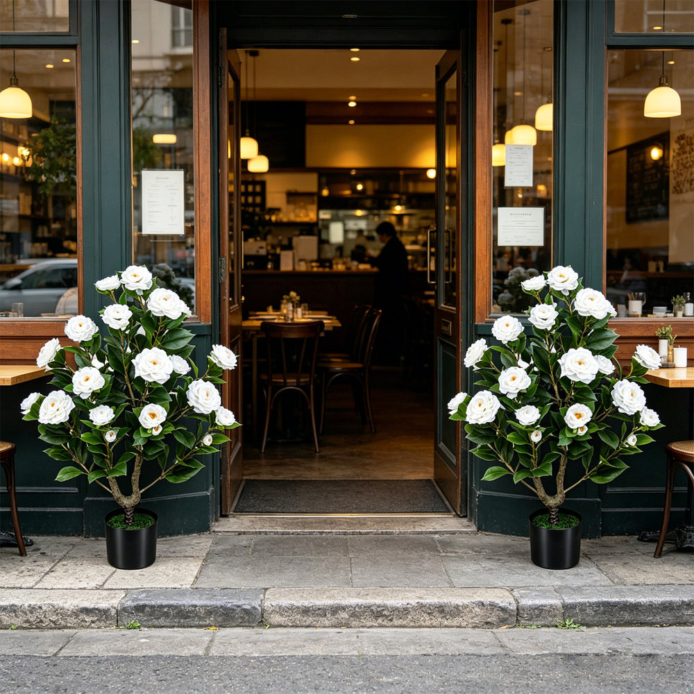 Two artificial camellia trees in cement-filled pots, featuring vibrant flowers and dense leaves, perfect for outdoor.