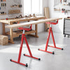 Folding roller stands in red with adjustable height, supporting heavy lumber feeding in a workshop setting.