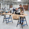 Heavy duty metal folding saw horses in blue with adjustable height, ideal for workshops and DIY projects.