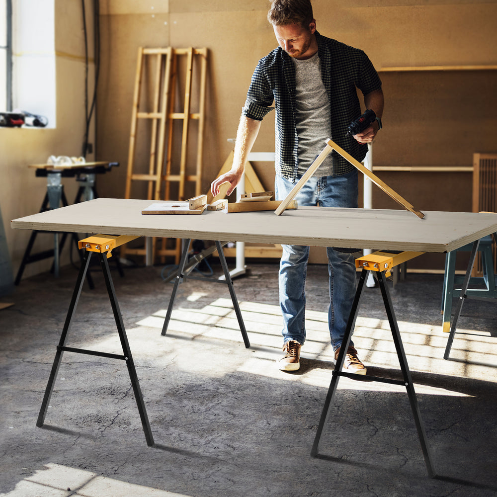Heavy-duty sawhorse with steel folding legs, supporting up to 275 lbs, ideal for workspace setup and portability.