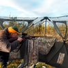 Hunting ground blind with 3 shoot-through ports, featuring camouflage design for concealment and quick pop-up setup.