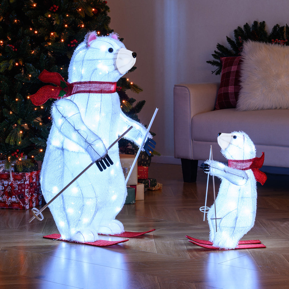 Animated skiing polar bears decoration with 160 bright LEDs and festive red scarves for cheerful holiday displays.