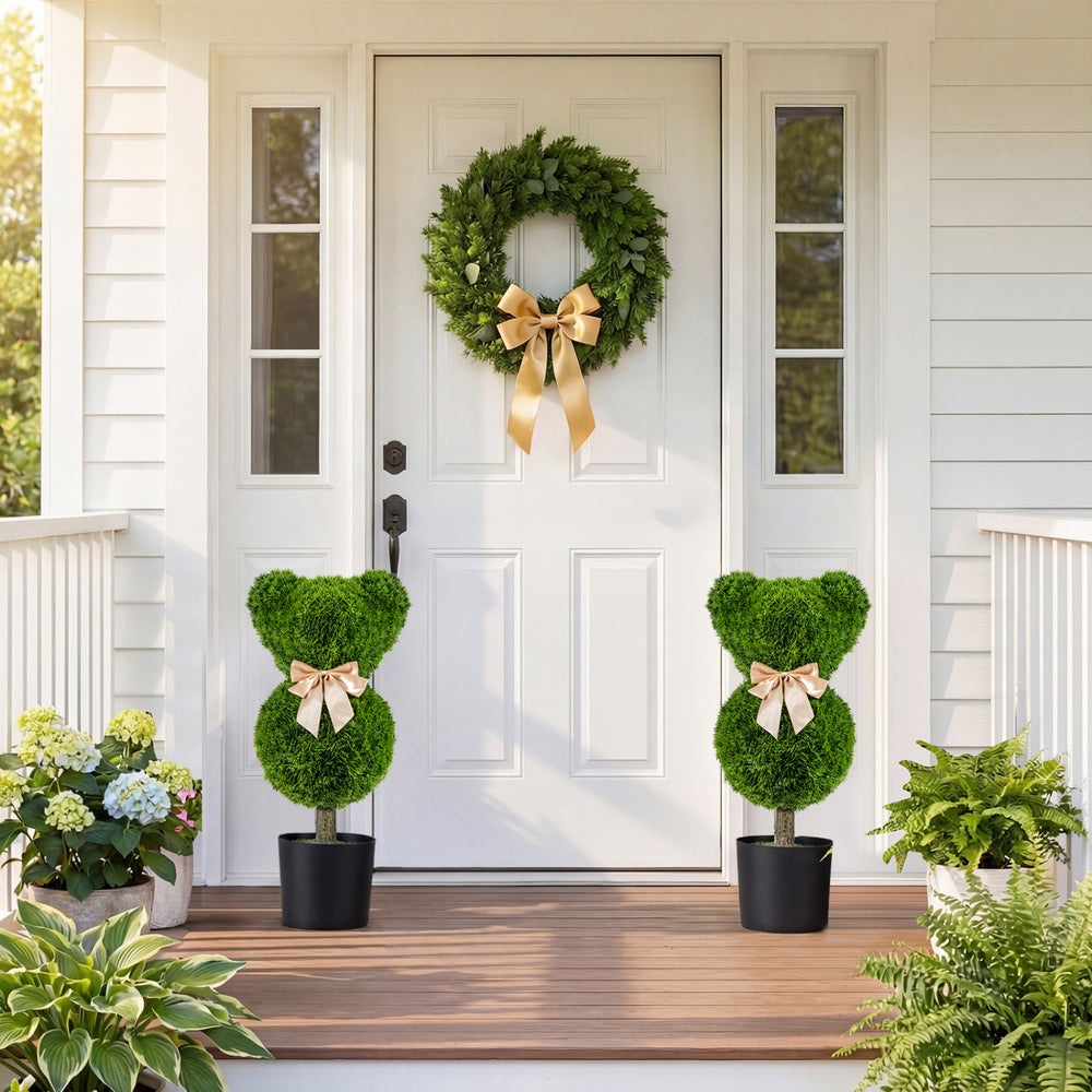 Bear-shaped topiary trees with golden bows in pots, perfect for doorsteps and playful decor. Sun-resistant faux plants.