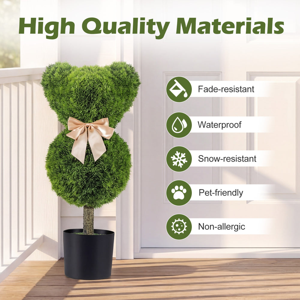 Bear-shaped topiary tree with golden bow in a cement-filled planter, made from sun-resistant, pet-friendly materials.