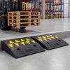 Driveway threshold ramps made of rubber with a 5/6 inch rise, featuring reflective patterns for visibility and traction.
