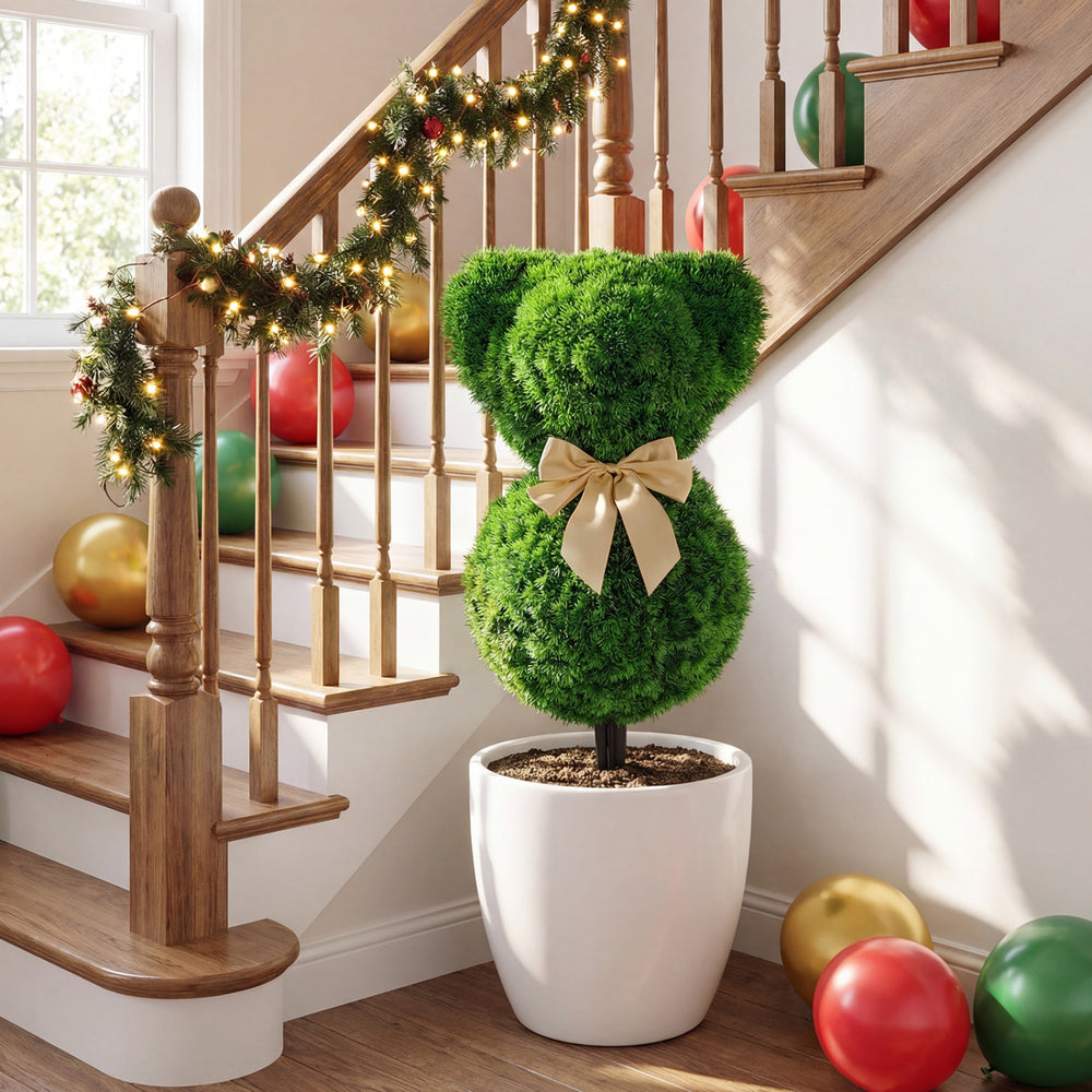 Adorable teddy bear topiary tree with golden bow, made of sun-resistant faux boxwood for indoor or outdoor decor.