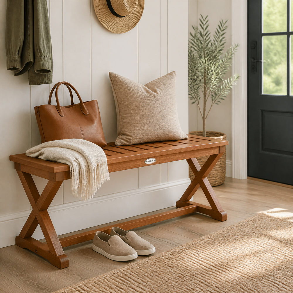 Solid wood outdoor bench with teak finish, slatted seat, and cross legs, perfect for patio or balcony seating.