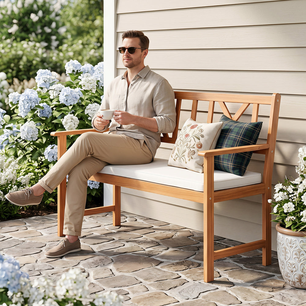 Acacia wood garden chair with removable seat cushion, featuring cozy armrests and supportive x-shaped backrest for comfort.