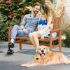2-person patio loveseat made of solid wood with slatted backrest, ideal for outdoor relaxation in backyards or patios.