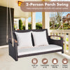 2-person patio rattan porch swing with white cushions, sturdy metal frame, and elegant design for backyard relaxation.