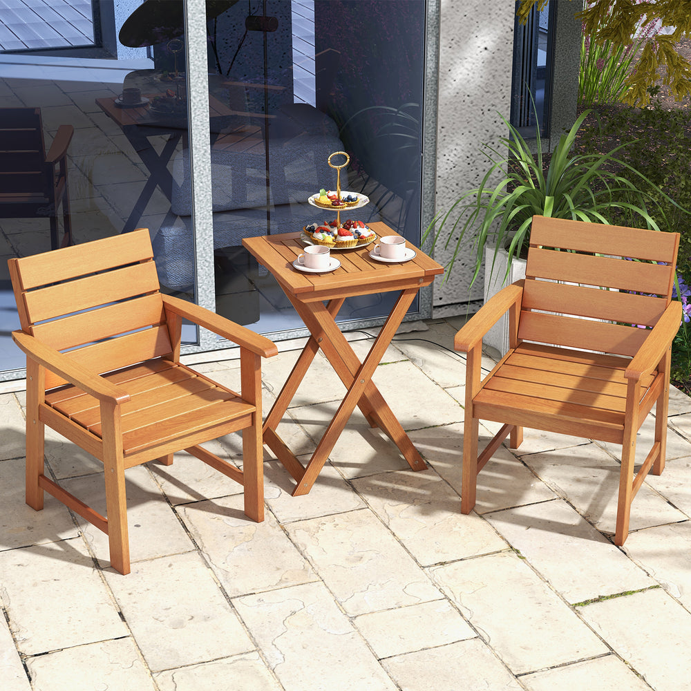 Two slatted hardwood patio chairs with inclined backrests and a small table, perfect for outdoor relaxation.