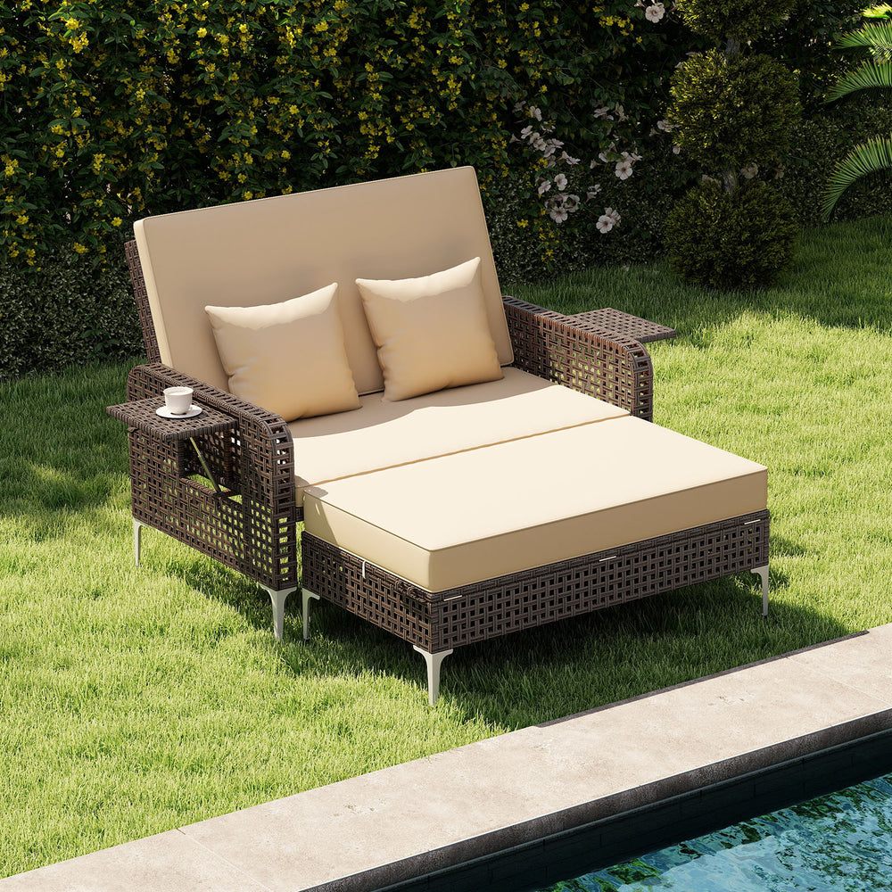Brown rattan loveseat and ottoman with adjustable backrest, soft cushions, perfect for poolside relaxation.