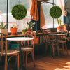 Faux decorative balls in vibrant green, ideal for indoor or outdoor use, enhancing patios, gardens, and balconies.